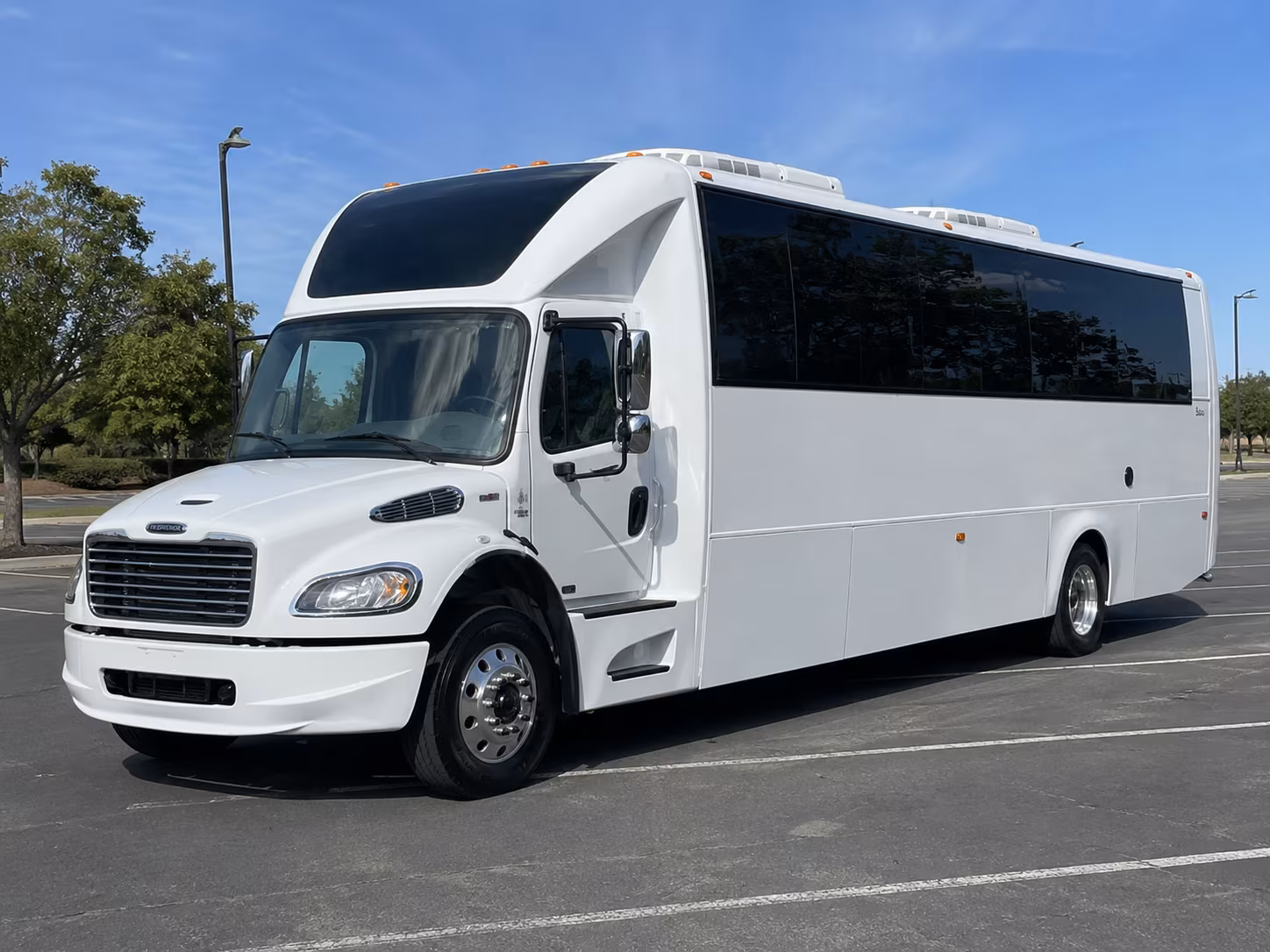 Group beside a Mercedes Sprinter limo in Fort Lauderdale